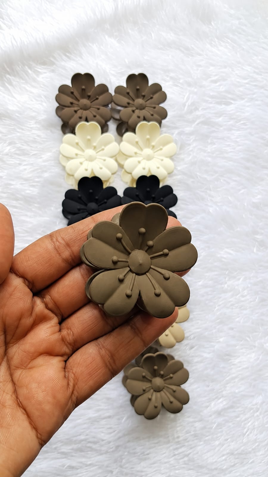 flower shaped claw clips in matte neutral tones flower shaped claw clips in matte neutral tones